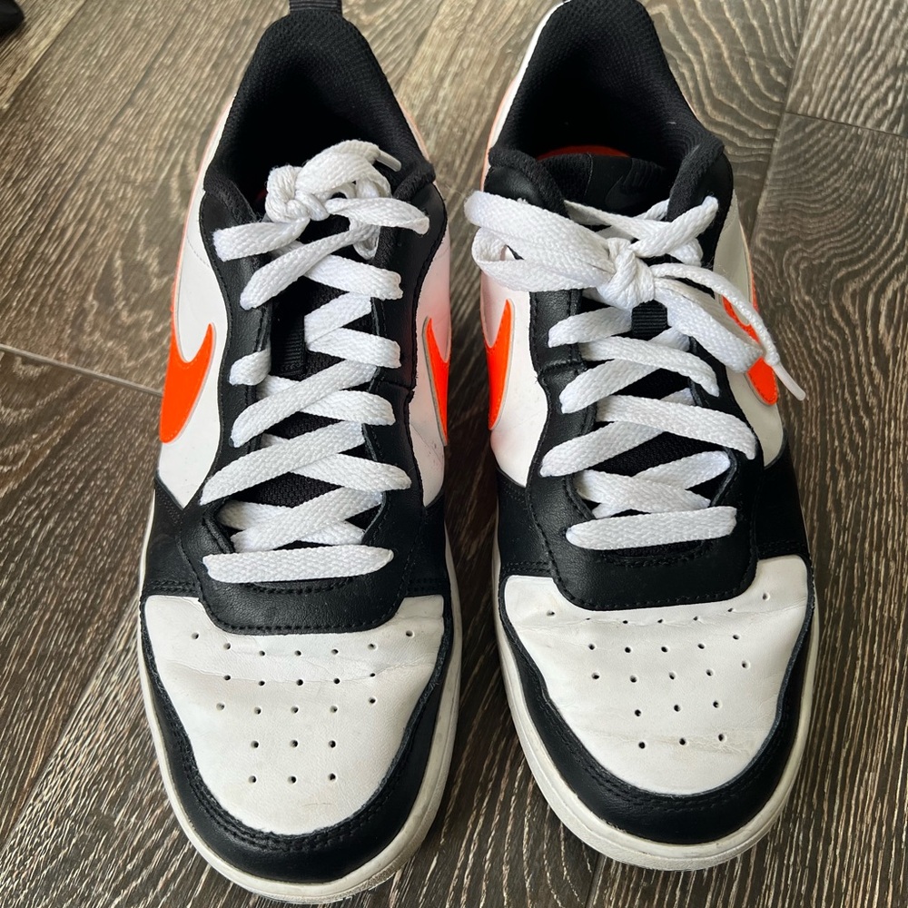 Nike Black and White Sneakers with Orange Accents